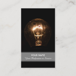 Retro light bulb illuminates the dark business card