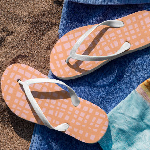 Retro pastel orange and pink grid pattern flip flops