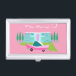 Retro Pink Palm Springs Business Card Holder<br><div class="desc">“palm Between the pink background, turquoise mid century modern home, and the classic 1950s car, this design couldn’t be more Palm Springs if it said it in the clouds. Oh, wait, it does say it in the clouds! The blue and teal stone of the house is offset by the sputnik...</div>