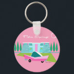 Retro Pink Palm Springs Button Keychain<br><div class="desc">Between the pink background, turquoise mid century modern home, and the classic 1950s car, this design couldn’t be more Palm Springs if it said it in the clouds. Oh, wait, it does say it in the clouds! The blue and teal stone of the house is offset by the sputnik light...</div>