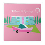 Retro Pink Palm Springs Ceramic Tile<br><div class="desc">Between the pink background, turquoise mid century modern home, and the classic 1950s car, this design couldn’t be more Palm Springs if it said it in the clouds. Oh, wait, it does say it in the clouds! The blue and teal stone of the house is offset by the sputnik light...</div>