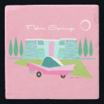 Retro Pink Palm Springs Stone Coaster<br><div class="desc">Between the pink background, turquoise mid century modern home, and the classic 1950s car, this design couldn’t be more Palm Springs if it said it in the clouds. Oh, wait, it does say it in the clouds! The blue and teal stone of the house is offset by the sputnik light...</div>