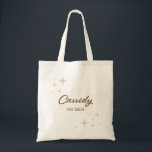 Retro Sparkles Script Name and Title Tote Bag<br><div class="desc">Retro, mid century style sparkles in peachy blush pink frame personalized first name text and a smaller line of text for a surname, role title, date or location. Fill these budget friendly bags with gifts, treats, and more and show your bridesmaids and bridal party how much you appreciate them. This...</div>