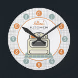 Retro Stove Personalized Kitchen Clock<br><div class="desc">A clock featuring an illustration of a retro beige kitchen stove.  Personalize with your name about illustration.  Clock features white numbers on orange and blue dots.</div>