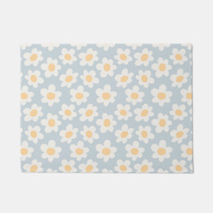 Retro style daisies in bloom on blue background doormat