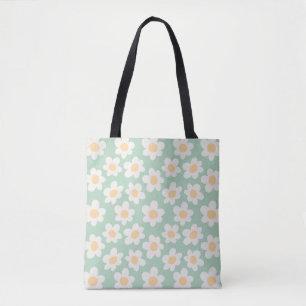 Retro style daisies in bloom on green background tote bag