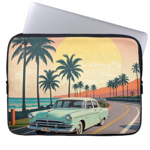 Retro-style vintage car on a coastal road laptop sleeve