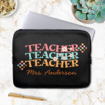 Retro Teacher in Colourful 70s Style Laptop Sleeve<br><div class="desc">Elevate your teacher's style with our personalized Groovy Retro Teacher in Colourful 70s Style Laptop Sleeve! A perfect gift for Teacher Appreciation Day. Featuring vibrant 70s colours and curved "teacher" text on a black chalkboard background, adorned with flower and chequered illustrations. Personalize it with the teacher's name for a truly...</div>