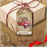 Retro Vintage Red Pickup Truck Merry Christmas Gift Tags<br><div class="desc">Beautiful retro vintage illustration of a red pickup truck loaded with Christmas Trees and gifts and on a retro grunge background and frame for an aged or vintage look. Design features a vintage scroll ribbon for your personalization both in the front or the back sides of this elegant, and timeless...</div>