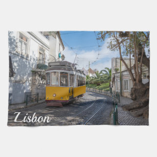 Retro yellow tram on street in Lisbon, Portugal Kitchen Towel
