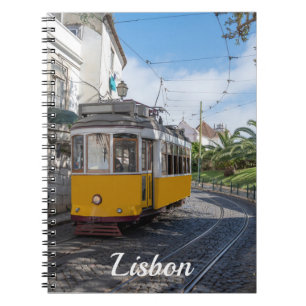 Retro yellow tram on street in Lisbon, Portugal Notebook