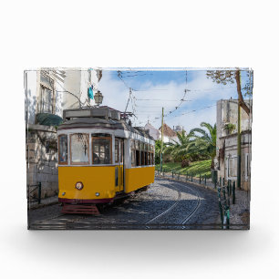 Retro yellow tram on street in Lisbon, Portugal Photo Block