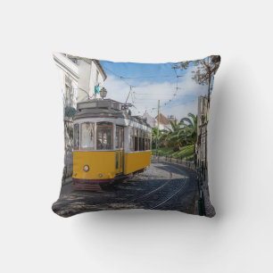 Retro yellow tram on street in Lisbon, Portugal Throw Pillow