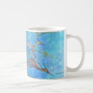 Rêver sur la tasse bleu vert de marées