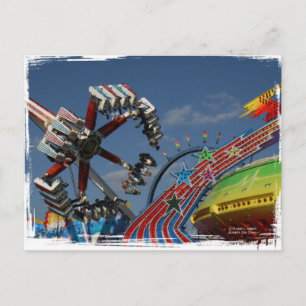 Rides at a county fair against a blue sky postcard