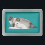 Ringed Seal Belt Buckle<br><div class="desc">A mother Ringed Seal and pup on an ice floe. As with the Polar Bears which prey on them, marine mammals such as the Ringed Seal are threatened by the changes caused by climate change to the Arctic ice pack. Named for the ring-shaped marks on their coats, the Ringed Seal...</div>