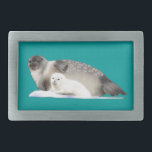 Ringed Seal Belt Buckle<br><div class="desc">A mother Ringed Seal and pup on an ice floe. As with the Polar Bears which prey on them, marine mammals such as the Ringed Seal are threatened by the changes caused by climate change to the Arctic ice pack. Named for the ring-shaped marks on their coats, the Ringed Seal...</div>