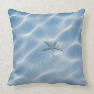 Rippled blue water with starfish throw pillow