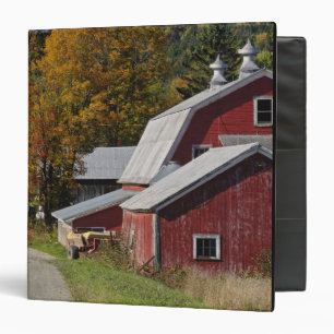 Road beside classic rural barn/farm in autumn, binder