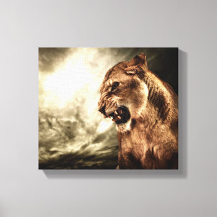 Roaring lioness against stormy sky canvas print