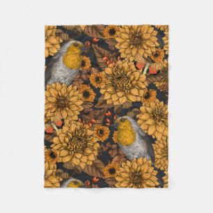 Robins in the autumn garden on black fleece blanket