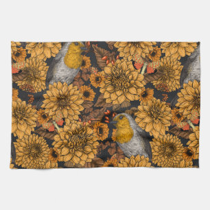 Robins in the autumn garden on black kitchen towel