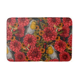 Robins in the autumn garden, red dahlias on black bath mat