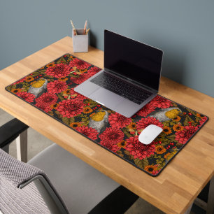 Robins in the autumn garden, red dahlias on black desk mat