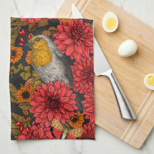 Robins in the autumn garden, red dahlias on black kitchen towel