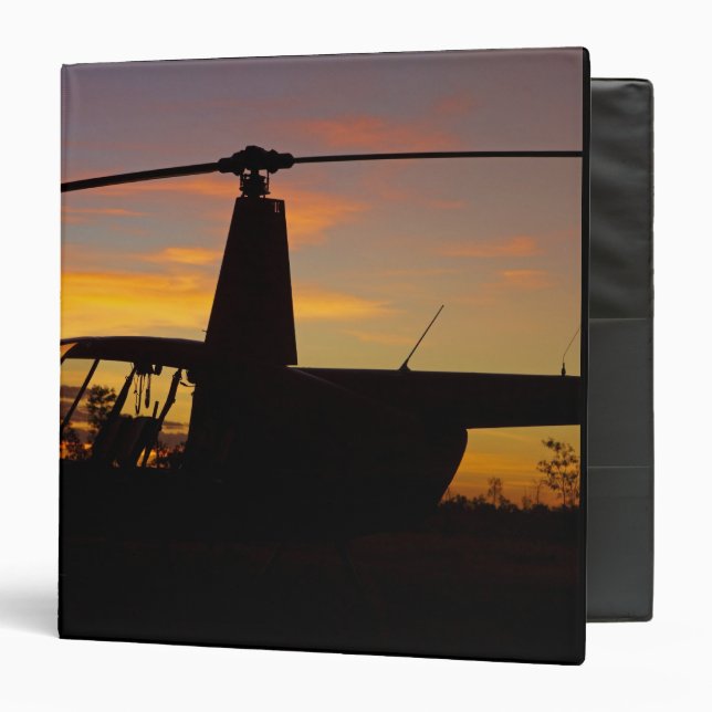 Robinson R44 helicopter at sunset Binder (Front/Inside)