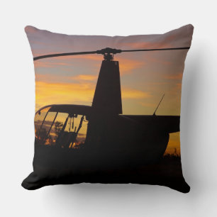 Robinson R44 helicopter at sunset Throw Pillow