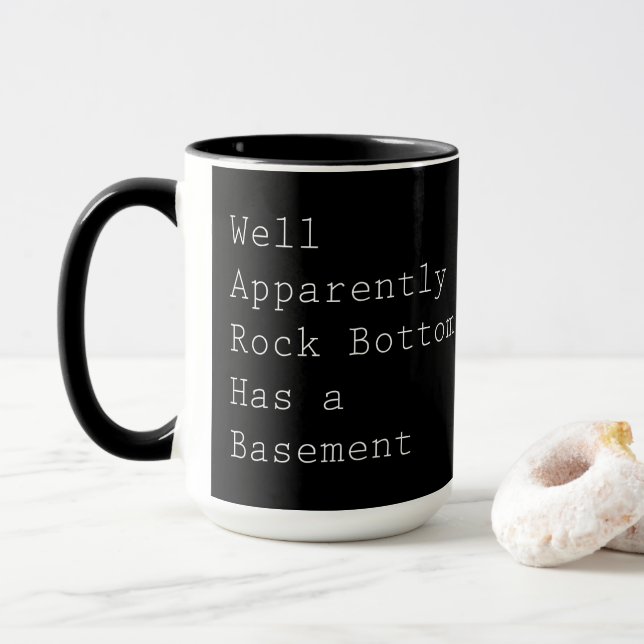 Rock Bottom Has a Basement on Black Mug (With Donut)