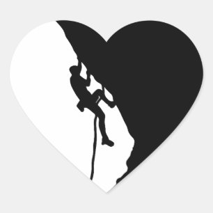 Rock climber conquers a sheer cliff.  heart sticker