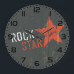 Rock Star Distressed Grunge Red Star Large Clock<br><div class="desc">Keep time with a rebellious beat using this rock star vintage grunge wall clock. This decorative timepiece features a prominent red star and distressed lettering set against a dark, textured backdrop, making it a standout addition to any music room, studio, or living space. The aged, retro design provides a raw...</div>