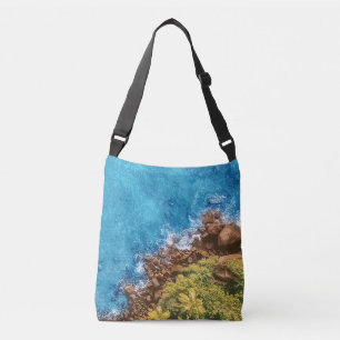Rocks in the sea, above view 1 crossbody bag