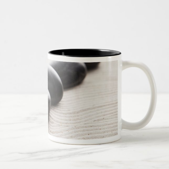 Rocks on sand Two-Tone coffee mug (Right)