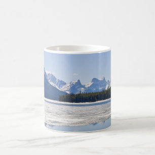 Rocky mountains reflecting in Maligne Lake Coffee Mug