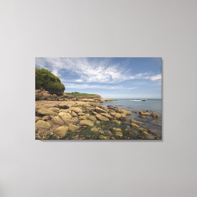 Rocky Seaside With Motorboat Travelling Canvas Print (Front)