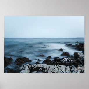 Rocky shore with misty water poster