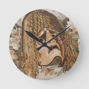 Roman mosaic, with mask, leaves and fruit round clock