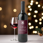 Romantic Calligraphy Merry Christmas Burgundy Wine Label<br><div class="desc">This Christmas wine label features elegant and romantic swirly calligraphy lettering,  accented with a winter berry holly bouquet . For more advanced customization of this design,  please click the BLUE DESIGN TOOL BUTTON. Matching items are also available.</div>