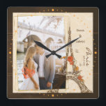 Romantic couple hugging near the eiffel tower square wall clock<br><div class="desc">Romantic couple hugging near the eiffel tower in paris Square Wall Clock.</div>