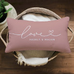Romantic Dusty Rose Love Heart Couple Names Lumbar Pillow<br><div class="desc">A romantic dusty rose lumbar pillow featuring Love in flowing white heart script with customizable couple names. The white-on-dusty-rose design brings a warm,  feminine accent perfect for wedding gifts,  anniversaries,  or newlywed home styling. All text is fully editable to personalize with any couple's names.</div>