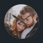 Romantic First Year Custom Photo Round Clock<br><div class="desc">Remember your first Christmas with a holiday photo, or one from your engagement or wedding. Your favourite photo, and personalizations can be whatever name, date or event you wish to place in the 2 text boxes. Handwritten look. Replace stock photo with your own, reverses to burgundy magenta colour with your...</div>