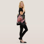 Romantic Pink Floral Bouquet on Black Tote Bag<br><div class="desc">Romantic and moody, this tote bag is the perfect gift for members of your bridal party. The floral design features a natural bouquet of blush pink roses and stunning ranunculus with dark green leaves in a luxurious arrangement on a black watercolor wash. You can personalize with a name and bridal...</div>