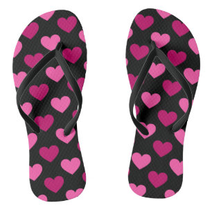 Romantic pink hearts on black pattern flip flops
