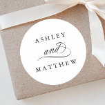 Romantic Swirly Calligraphy Wedding Classic Round Sticker<br><div class="desc">Simple black and white wedding sticker featuring elegant and romantic swirly calligraphy lettering with your names. For more advanced customization of this design,  please click the BLUE DESIGN TOOL BUTTON above!</div>