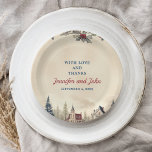 Romantic Winter Wedding Paper Plate<br><div class="desc">Dine in winter elegance with our wedding plate! Featuring snowfall, holly berries, and a snow-clad pine tree against a charming winter village, it's your ticket to a festive feast. Let your culinary creations shine on this snowy canvas, adding a touch of whimsy to your reception. From bites of delight to...</div>