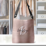 Rose Gold Brushed Metal Script Monogram  Crossbody Bag<br><div class="desc">This elegant personalized crossbody bag features a monogram and first name in modern black and white script on a rose gold faux brushed metal background.</div>