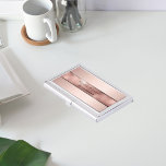 Rose gold metallic elegant modern business business card holder<br><div class="desc">An elegant, simple minimalistic and modern business card holder . A rose gold and pink metallic looking background with a rose gold band. Personalize and add your name and text/title on front. Black letters. The name is written with a modern and trendy hand lettered style script. Perfect for female entrepreneurs,...</div>